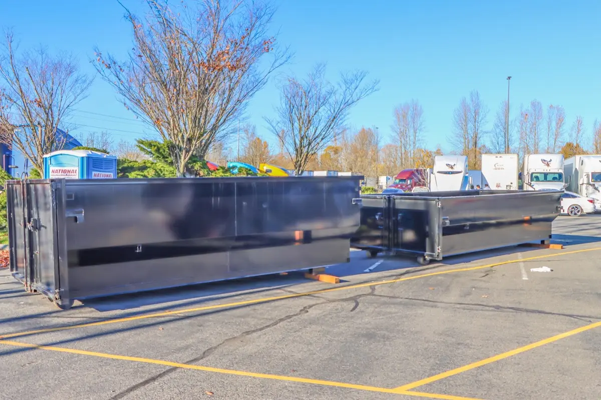 Professional dumpster rental service with roll-off container on residential driveway in Snohomish